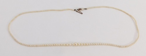 A single strand cultured pearl necklace, with a white gold clasp stamped 9c, the beads graduated, 43cm long, 3.5g all in.