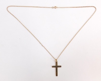 A 9ct gold crucifix pendant and chain, the crucifix of plain design, 3cm high, on a 44cm curb link chain, 3.8g.