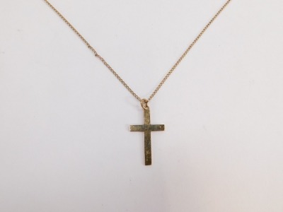 A 9ct gold crucifix pendant and chain, the crucifix of plain design, 3cm high, on a 44cm curb link chain, 3.8g. - 2