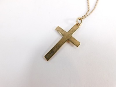 A 9ct gold crucifix pendant and chain, the crucifix of plain design, 3cm high, on a 44cm curb link chain, 3.8g. - 3