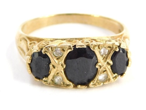 A 9ct gold gypsy ring, set with three dark blue stones and four CZ, size O½, 3.7g all in, boxed.