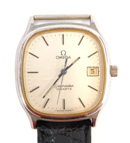 An Omega Seamaster gentleman's wristwatch, in a stainless steel case, with Seamaster motif, part black leather strap, with date aperture, the dial 3cm diameter.