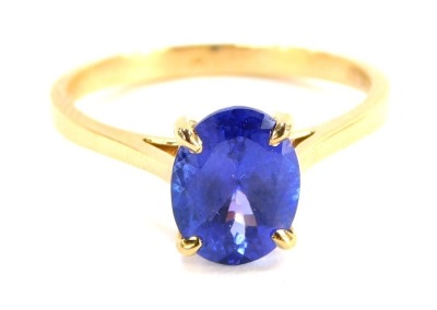 A tanzanite dress ring, with single oval tanzanite, measuring 2.02cts, grade AAA, in four claw setting with pierced design shoulders, yellow metal stamped 18k, size P½, 3g all in, boxed.