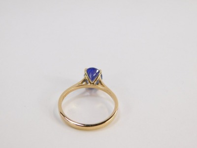 A tanzanite dress ring, with single oval tanzanite, measuring 2.02cts, grade AAA, in four claw setting with pierced design shoulders, yellow metal stamped 18k, size P½, 3g all in, boxed. - 2