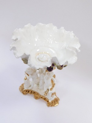 A Victorian Moore Brothers porcelain comport, the flared bowl with applied blackberry detail, on a tripod base, with three cherubs, with gilt detailing, unmarked, 30cm high. - 2