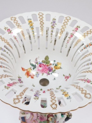 A Dresden porcelain centrepiece, the elaborately decorated fluted and pierced top in pink and turquoise with gilt detail, applied flowers and figure of lady and gentleman to stem, on scroll feet, 42cm high. - 2