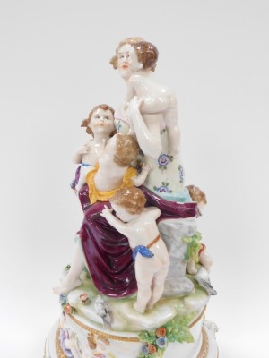 A Capodimonte porcelain figure group of mother and four children, on a circular foot, with four scroll feet, 41cm high. - 3