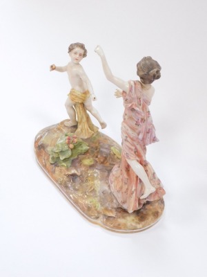 A late 19thC porcelain figure group of a lady chasing child, on a circular base, numbered to underside 217, restored, 21cm high, 24cm wide. - 3