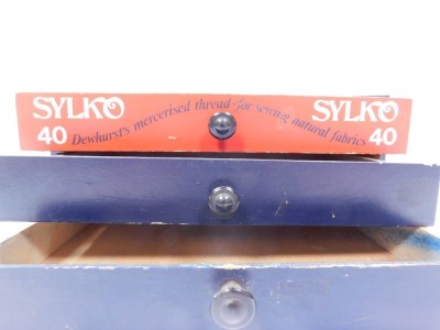 A Sylko advertising thread case, with three drawers painted in blue and red, with ebonised handles, 14cm high, 31cm wide, 22cm deep. - 3