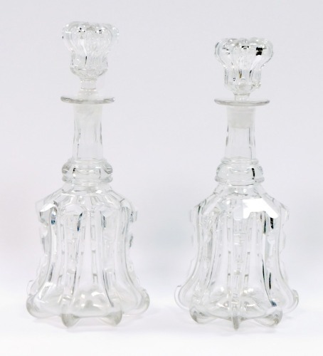 A pair of 19thC cut glass mallet shaped decanters, each with an applied and fluted ribbing, 31cm high.