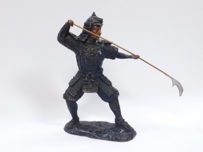 A bronze figure of a warrior, in pounced pose, with stork applied cresting to armour, on a circular base, 38cm high, 22cm wide. - 2