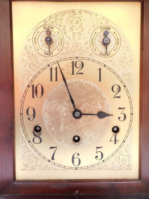 An early 20thC oak cased mantel clock, with arched pediment top and two column support, with a brass dial with Westminster chiming movement, 42cm high, 28cm wide, 21cm deep. - 2