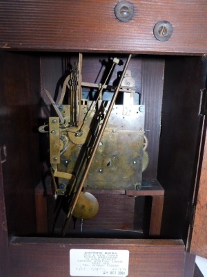 An early 20thC oak cased mantel clock, with arched pediment top and two column support, with a brass dial with Westminster chiming movement, 42cm high, 28cm wide, 21cm deep. - 5