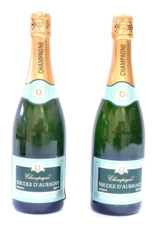 Two Nichol D'Aurigny bottles of Champagne.