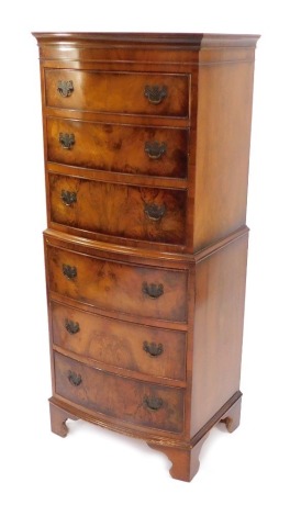 A walnut bowfront chest on chest, with six drawers, on bracket feet, 132cm high, 53cm wide, 42cm deep.