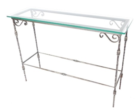 A modern glass and steel finish hall table, with steel base, 76cm high, 107cm wide, 34cm deep.