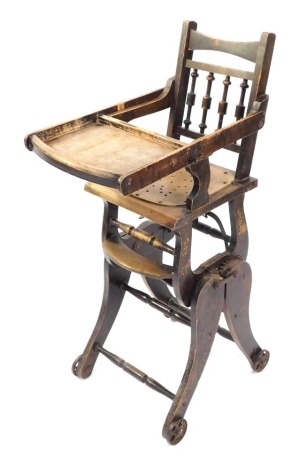 A Victorian child's high chair, on wheeled supports, 100cm high, 33cm wide, 42cm deep.