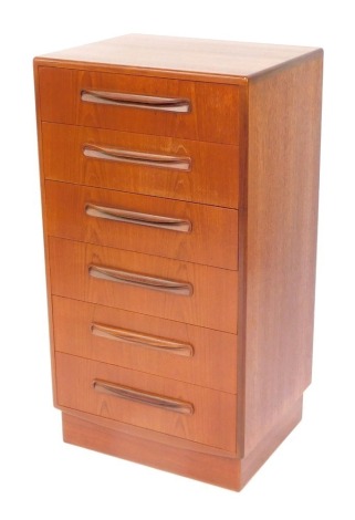 A 1970's teak six drawer chest of drawers, each with moulded handles, on a plinth, 102cm high, 56cm wide, 44cm deep.