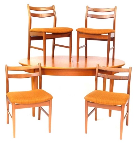 A 1970's teak extending oval dining table and chairs, the table with pullout extendable section, 151cm wide when closed, 70cm high, 90cm deep, together with a set of four matching chairs, each with chequered and upholstered seats, with two splat backs. T