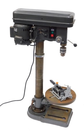 A Tull International twelve speed drill press, model TU0050, circa 1987, serial number J55933, 100cm high.