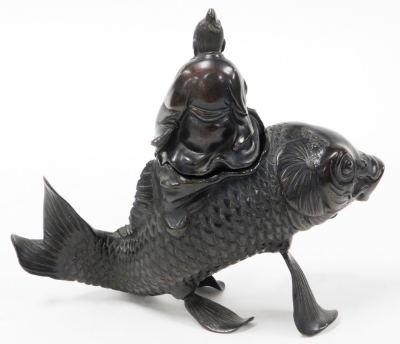 A Japanese Meiji period bronze vessel and cover, shaped as the figure of Kinko holding a book or scroll (now missing) riding a carp, 19cm high. - 3