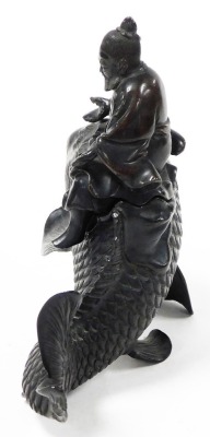 A Japanese Meiji period bronze vessel and cover, shaped as the figure of Kinko holding a book or scroll (now missing) riding a carp, 19cm high. - 4