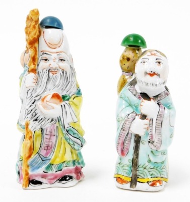 A Chinese pottery figure of a sage, carrying yoke bearing a coin and a flowering peach, 15cm high, and two porcelain figural snuff bottles, 9cm and 8cm high. - 2