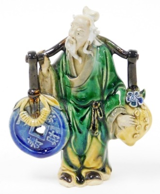 A Chinese pottery figure of a sage, carrying yoke bearing a coin and a flowering peach, 15cm high, and two porcelain figural snuff bottles, 9cm and 8cm high. - 8