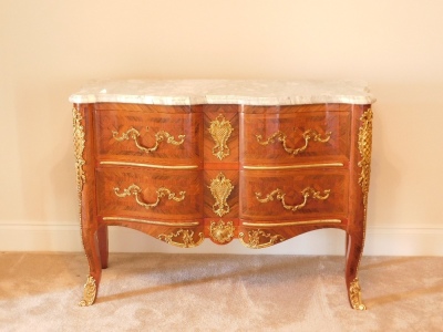 A 20thC kingwood parquetry commode, with marble top, gilt brass adornments to the two drawer front apron and legs, 89cm high, 125cm wide 50cm deep. Provenance: Upon instructions from the executors of Mrs Sandra Mapletoft (Dec'd) who purchased this as Lot - 12