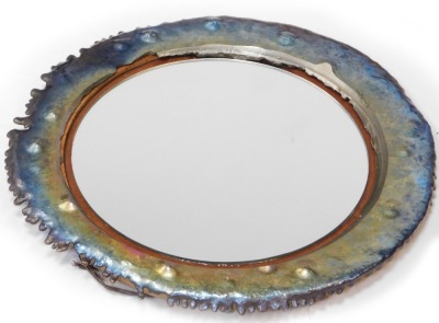 A modern wall art mirror, the outer metal frame in a multicoloured overlay finish in steel, with central mirror plate on a wooden backing, 63cm diameter. - 5