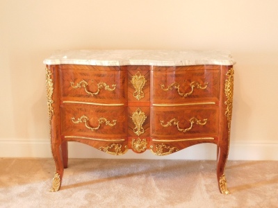 A 20thC kingwood parquetry commode, with marble top, gilt brass adornments to the two drawer front apron and legs, 89cm high, 125cm wide 50cm deep. Provenance: Upon instructions from the executors of Mrs Sandra Mapletoft (Dec'd) who purchased this as Lot - 7