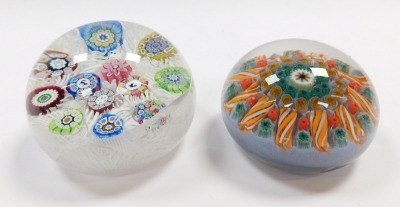 A Perthshire 1973 dated millefiori and scrambled cane paperweight, decorated with silhouette motifs, 7cm diameter, together with a millefiori and tubular cane paperwork, 6.5cm diameter. (2, AF) - 3