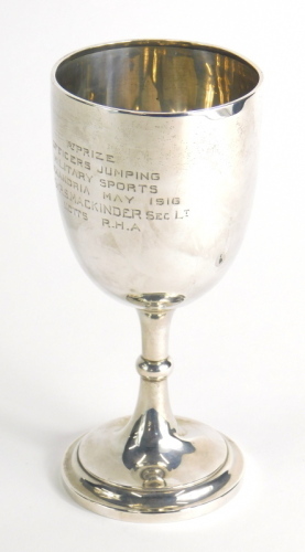 A George VI silver goblet, with inverted stem and circular foot, marked First Prize Officers Jumping Military Sports...May 1916, London 1914, 18cm high, 4.3oz.