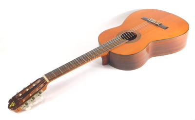 A 20thC Japanese Takeharu acoustic guitar, model GT-85 numbered 80462 with Kiso Suzuki Violin Co label, 98cm long.