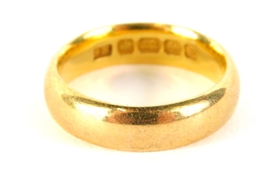 A 22ct gold wedding band, size J, 5.8g.
