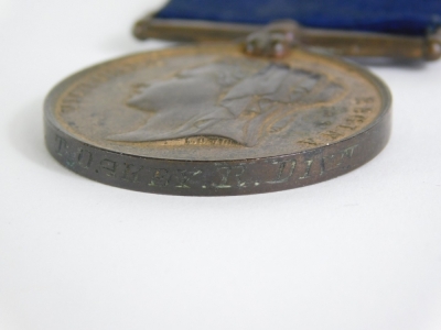 A Victorian Metropolitan Police medal, Jubilee 1887, marked FS T Oakey R DIV, with blue ribbon. - 2