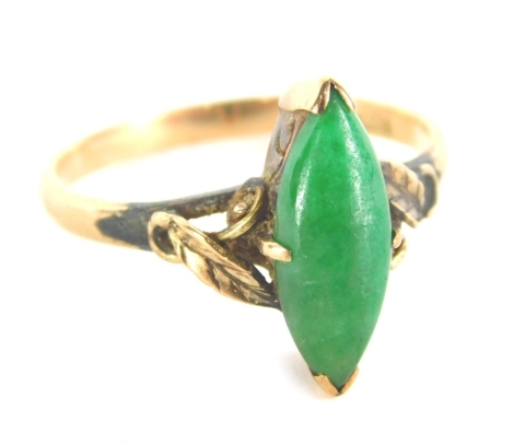 A dress ring, with shaped green stone on a textured part pierced shank marked 14K, size O, 2.7g all in.