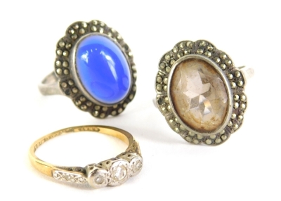 A dress ring, illusion set with small white stone, indistinctly marked, size M and two further dress rings. (3)