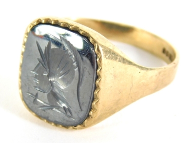 A 9ct gold seal ring, a blue stone inset with figure head, size S, 3.9g all in.