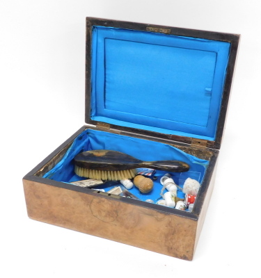 A late 19thC walnut jewellery box, the domed lid with Mother of Pearl centre section hinged to reveal the plane interior with various fan, thimbles, etc., the box, 14cm high, 30cm x 23cm deep.