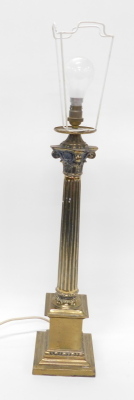 A brass Corinthian column table lamp, with modern electric feature, 75cm high.