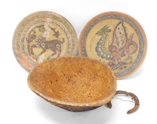 A pair of Studio pottery wall plates, each of circular form, decorated with heraldic beasts, with sgrafitto decoration, 34cm diameter (2) and various metal markers or rods, each with shaped heads. (a quantity)