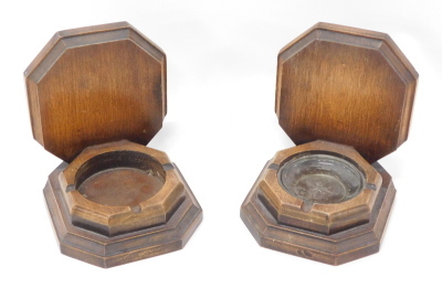 A pair of oak bookends, each of shaped form, with octagonal backs, 18cm high. (2)