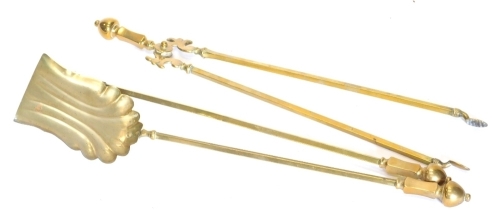 A Regency style brass fireside companion set, to include coal tongs 58cm high, etc. and an African tribal figure of a nude lady (a quantity).