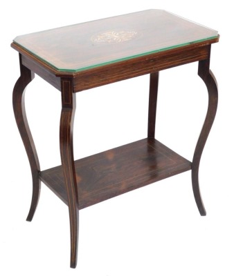 An Edwardian rosewood and marquetry occasional table, the rectangular top with canted corners, on shaped supports with under tier, 70cm high, 60cm wide.