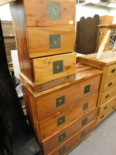 A hardwood chest of four drawers, a similar bedside chest of three drawers.