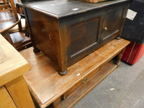 A rectangular coffer with two drawers and two low door cabinet.