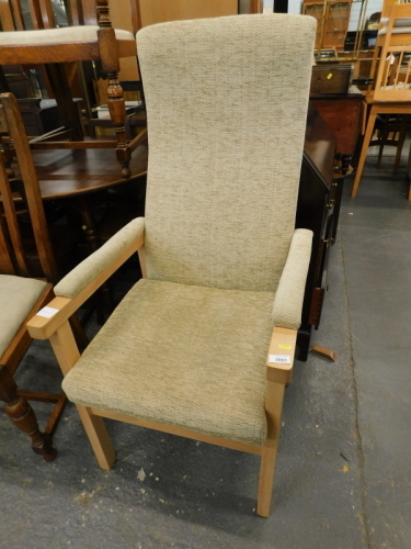 A modern beech open armchair, upholstered in beige fabric.