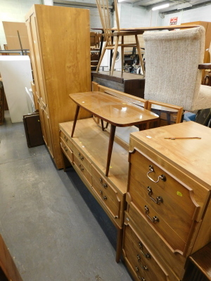 A wood effect wardrobe, matching dressing table, two bedside tables and a 1960's coffee table. (5)