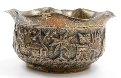 A collection of Oriental silver coloured metalware pieces, to include a goblet with embossed and repousse decoration of buildings, figures, etc., a similar bowl, small mug with a hunting scene, stamped T90, parasol handle, and trefoil dish, etc. (6) - 4